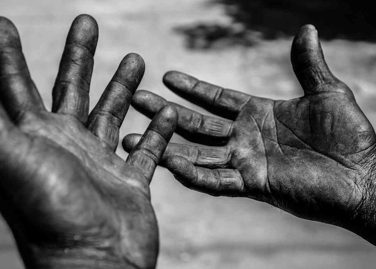 Image of a worker's worn work hands