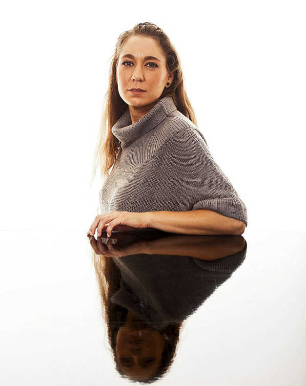 Image of a woman at a conference room table